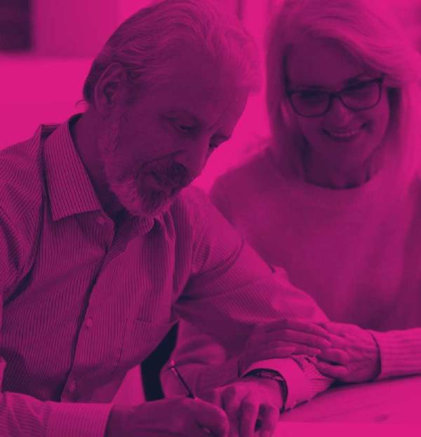 elderly couple looking over estate planning paperwork